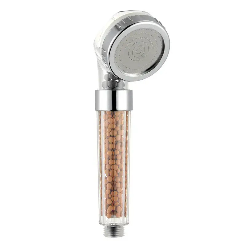 Clear cylindrical chrome shower head with visible brown decorbites anion spa beads for high pressure water saving use