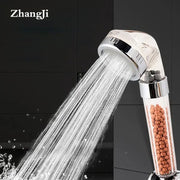 Chrome decorbites anion spa shower head with clear cylindrical housing and orange filtration beads for high pressure use