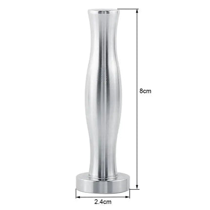 Silver aluminum espresso tamp with textured grip and flared base alongside chrome cylindrical coffee pod holder organizer
