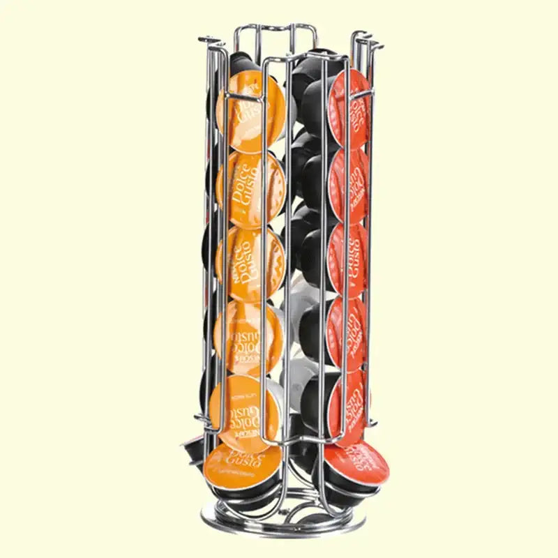 A sleek chrome cylindrical coffee pod holder organizing rows of orange and red Dolce Gusto coffee pods