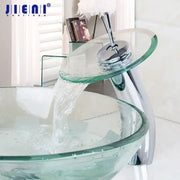 Chrome glass waterfall faucet with clear glass and chrome finish, paired with a transparent bowl bathroom sink basin