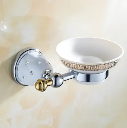 Chrome finished wall-mounted soap dish with white ceramic bowl and gold greek key pattern in decorbites bathroom hardware set