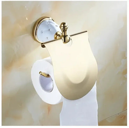 Gold-toned toilet paper holder with crystal accent and sleek design from decorbites bathroom hardware set