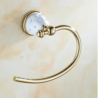Gold-toned towel ring with decorative white ceramic head and clear crystals from decorbites bathroom hardware set