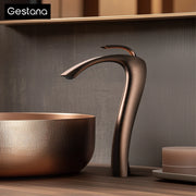 Gestana bronze-finished waterfall faucet with sleek curved design single hole brass housing material for cold water control