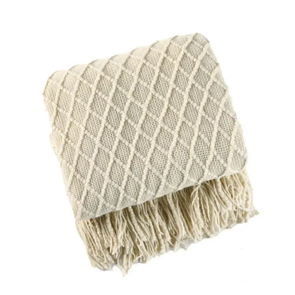 Cream-colored cozy knitted sofa blanket with diamond pattern and fringe for living room decorbites cozy knitted comfort