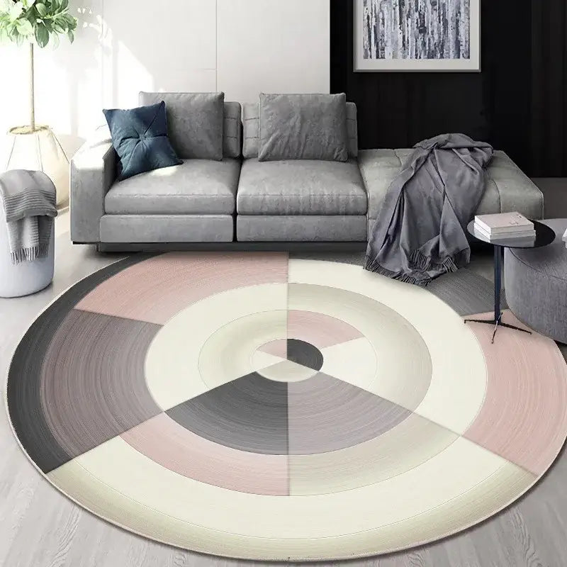 Circular geometric cashmere floor mat with concentric patterns in beige, pink, cream, gray, and black for living room decorbites