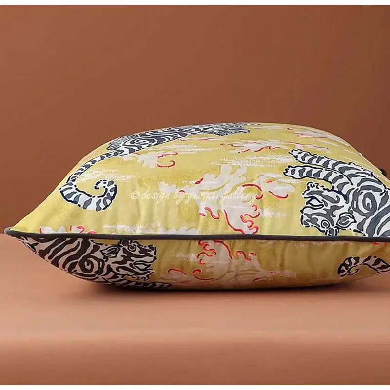 A vibrant yellow cushion cover with bold black and white tiger patterns and red accents for decorbites circus horse decorbites circus horse print living room decor