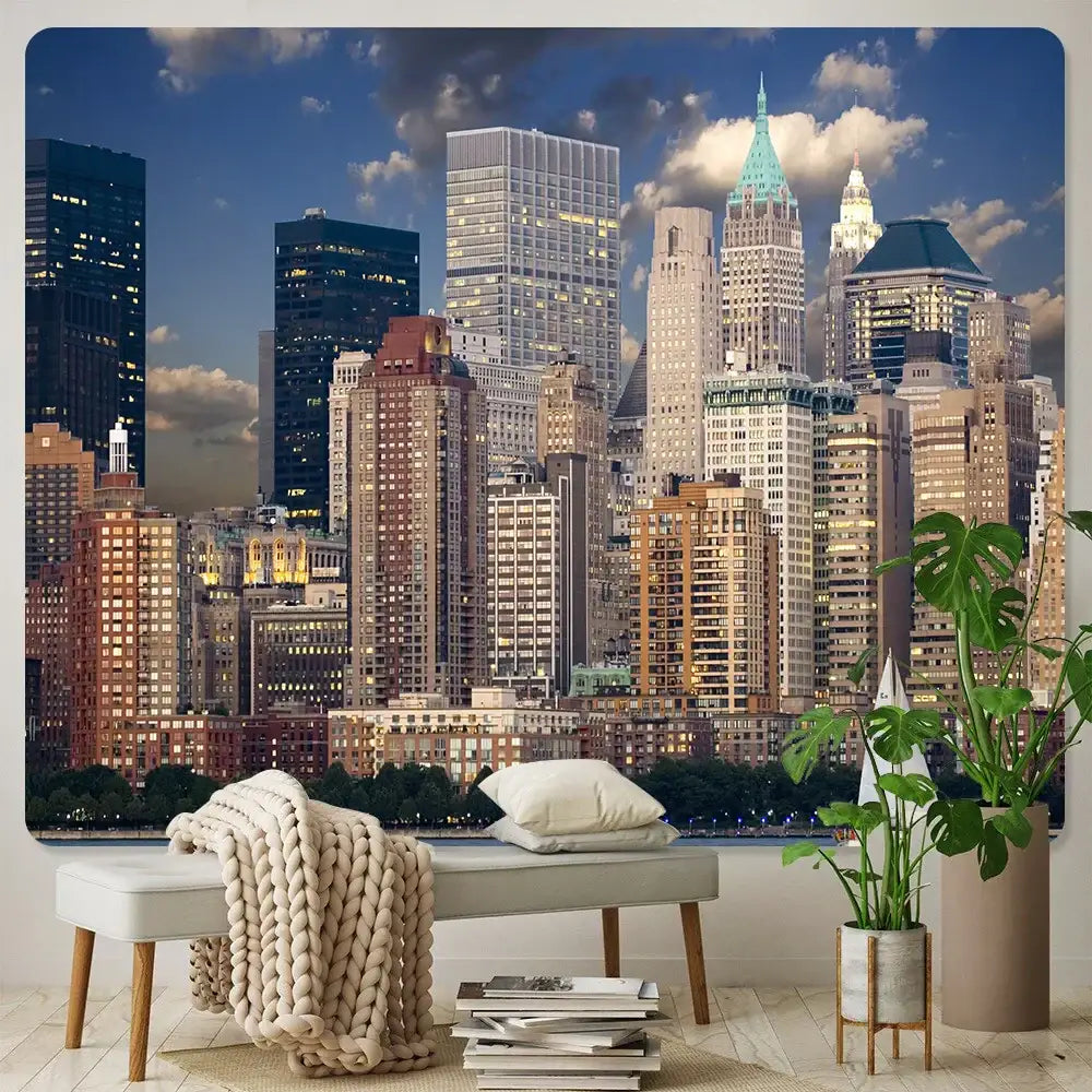 A beige knitted throw blanket draped over a light gray bench complements decorbites city night bohemian wall hanging