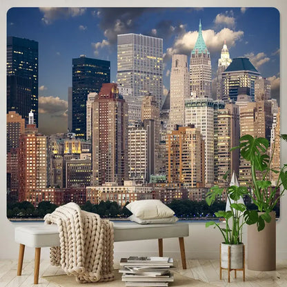 A beige knitted throw blanket draped over a light gray bench complements decorbites city night bohemian tapestry wall hanging