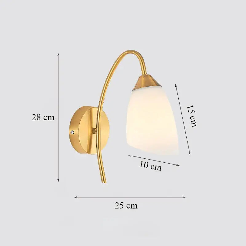 Classic brass glass wall sconce with gold-toned curved arm and frosted shade for bedroom decorbites brass glass design