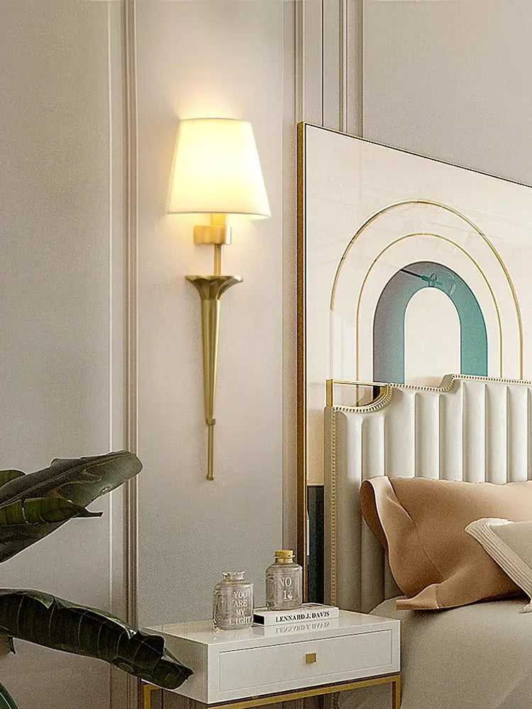 Classic gold fluted wall lamp with tapered base and soft white fabric shade perfect for bedroom decorbites copper wall lamp