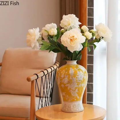 A yellow ceramic vase with white floral and bird motifs and decorative base for classical blue and white porcelain decorbites white porcelain vase
