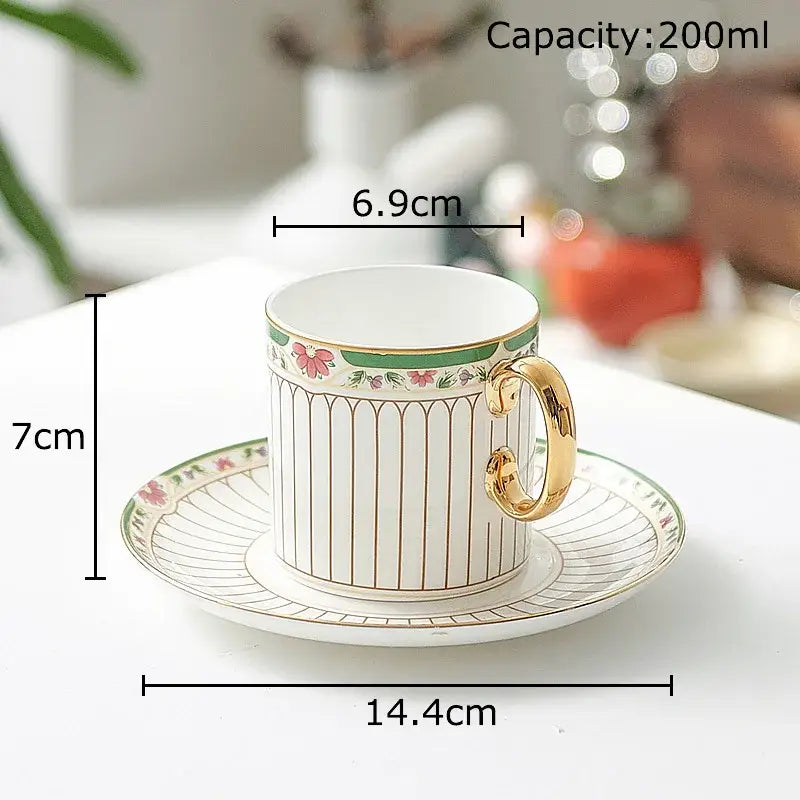 Classical gold-striped ceramic cup and saucer set with white ceramic cup, gold trim, and pink floral accents for dining room