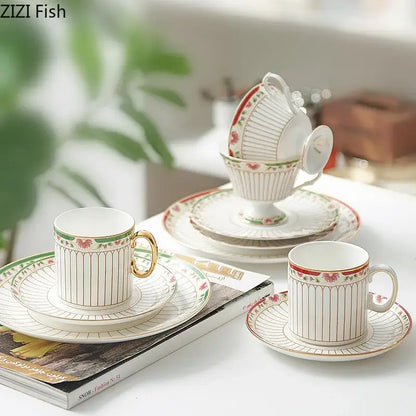 Classical gold-striped ceramic cup and saucer set with white porcelain and red floral accents for dining room use