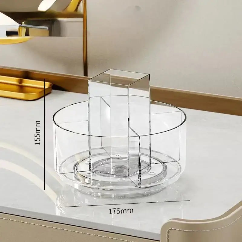 Clear acrylic rotating makeup organizer with circular base and central compartment for bedroom vanity storage