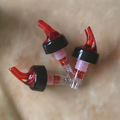 Clear and red plastic liquor pourer bottle dispenser with translucent bodies for decorbites liquor pourer use in kitchen barware