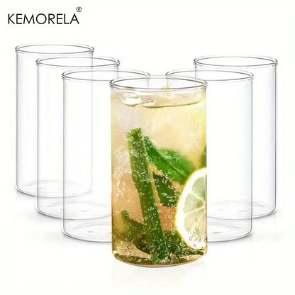 Clear borosilicate drinking glass filled with refreshing beverage garnished with mint and lime in drinking glasses set