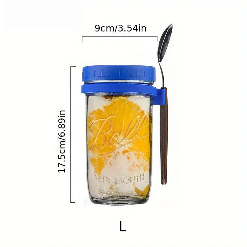 Clear borosilicate drinking glass jar with blue lid and handle containing orange slices from drinking glasses set