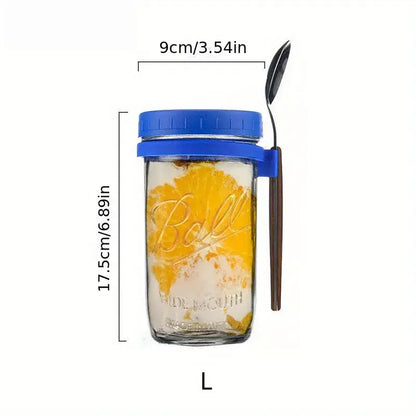 Clear borosilicate drinking glass jar with blue lid and handle containing orange slices from drinking glasses set