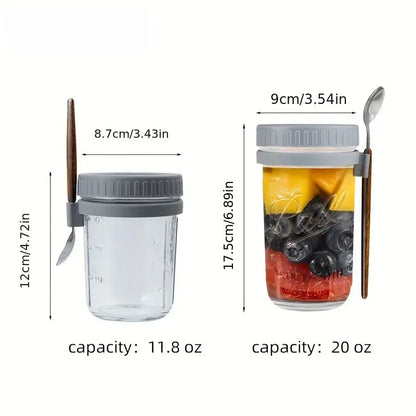 Clear borosilicate drinking glass mason jar with gray lid, wooden spoon, and measurement markings in drinking glasses set