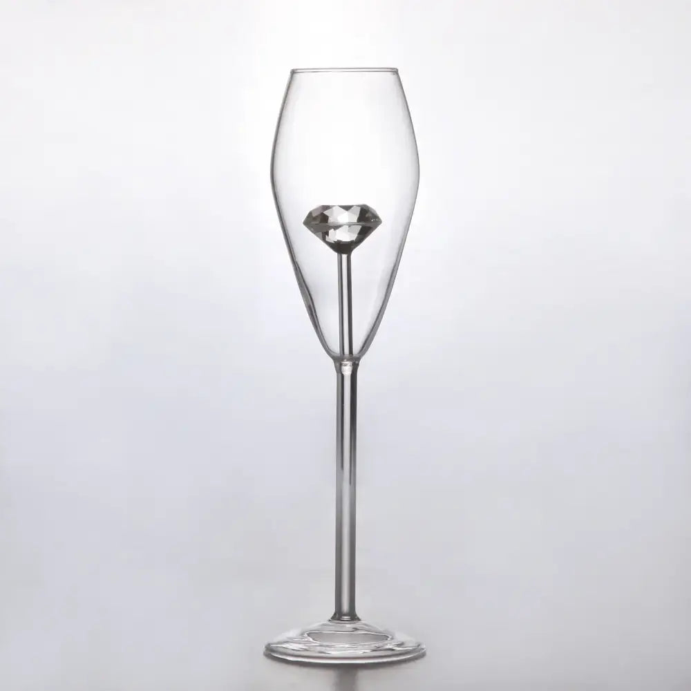 Clear diamond glass champagne flute with a faceted diamond ornament in the stem for elegant dining decorbites clear diamond