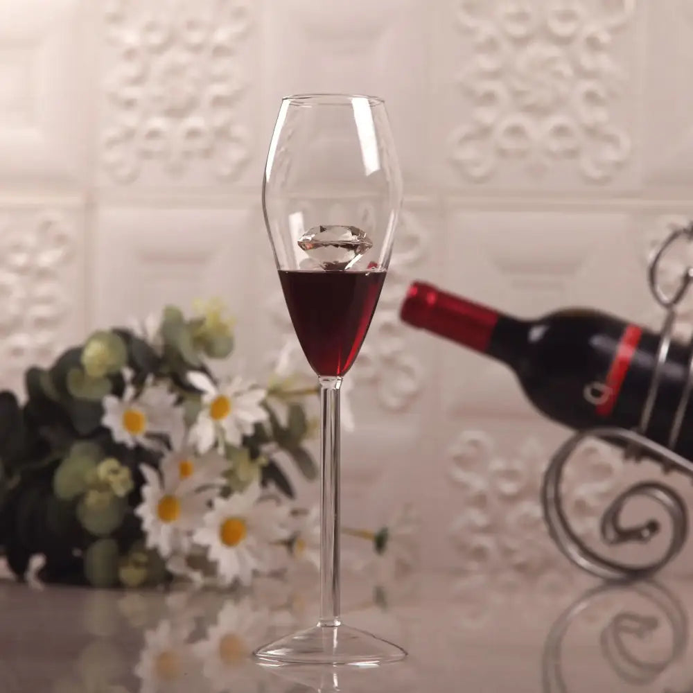 Clear diamond glass champagne flute filled with diamond glass red wine and sparkling diamond-shaped ice cube decorbites clear diamond
