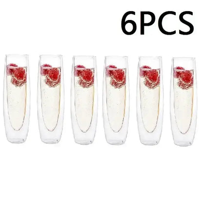 Six clear double wall stemless champagne glasses with raspberries and sparkling liquid for elegant dining room use