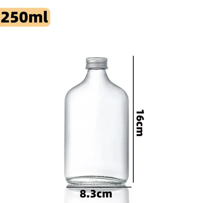 Clear glass beverage bottle with silver metal cap 250ml 16cm height 8.3cm base from decorbites clear glass set
