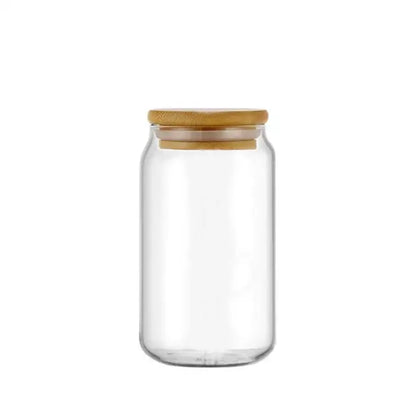 Clear glass drink cup with a natural bamboo lid and straw in a decorbites glass drink cup for kitchen soda use