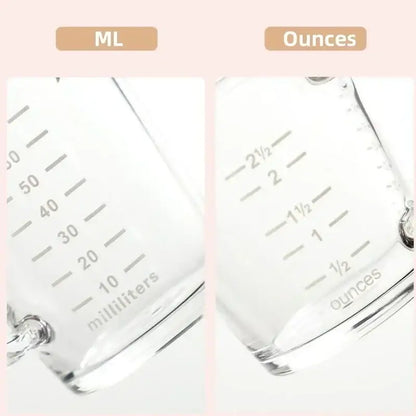 Clear glass espresso measuring cup with handle featuring engraved milliliter and ounce markings for precise measuring