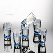 Clear glass liquor cup set with measurement markings featuring clear crystal glass and blue diamond-shaped bases decorbites clear glass