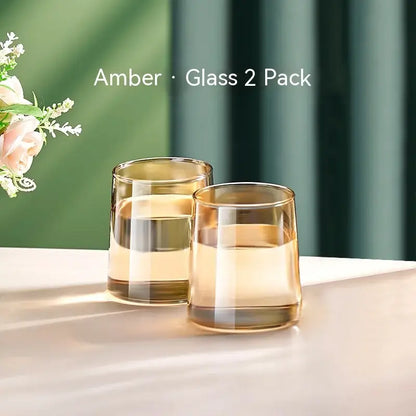 Amber-colored glass tumblers with a sleek modern design and gradient finish from decorbites glass juice kettle set