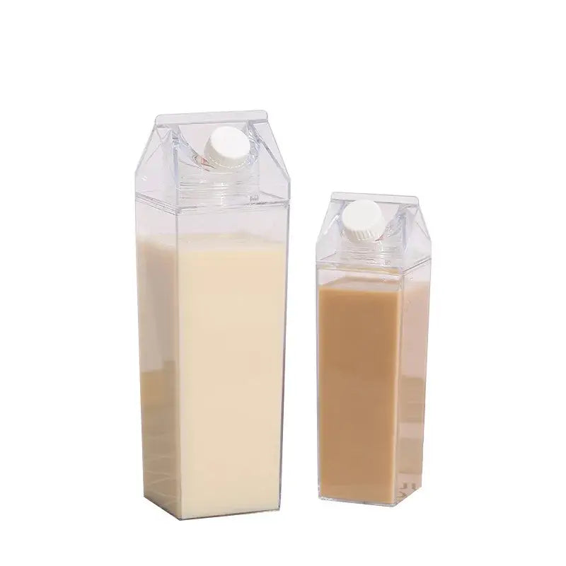 Two transparent clear milk carton water bottles by decorbites with white and brown liquids topped with white caps for kitchen use