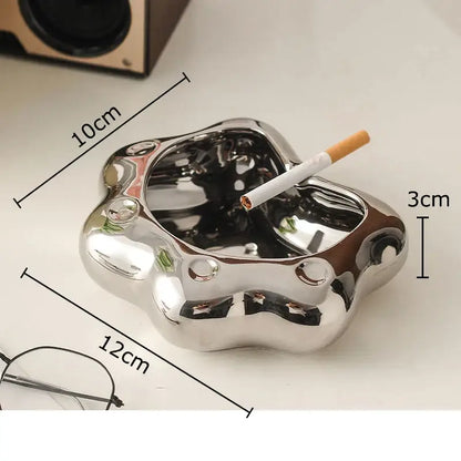Shiny metallic cat paw porcelain ashtray with smooth reflective surface and rounded edges for decorbites cat paw gift