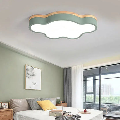 Cloud led baby chandelier with sage green body, natural wood trim, and illuminated white center for pink bedroom decorbites cloud led