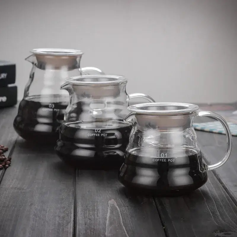 Cloud shaped glass coffee kettles with stainless steel lids and handles marked 01 02 and 03 by decorbites