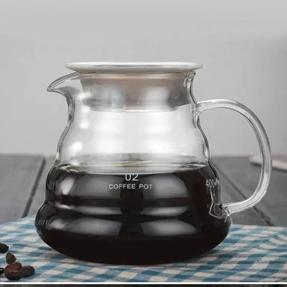 Clear glass coffee kettle with silver lid and measurement markings from decorbites cloud shaped glass collection