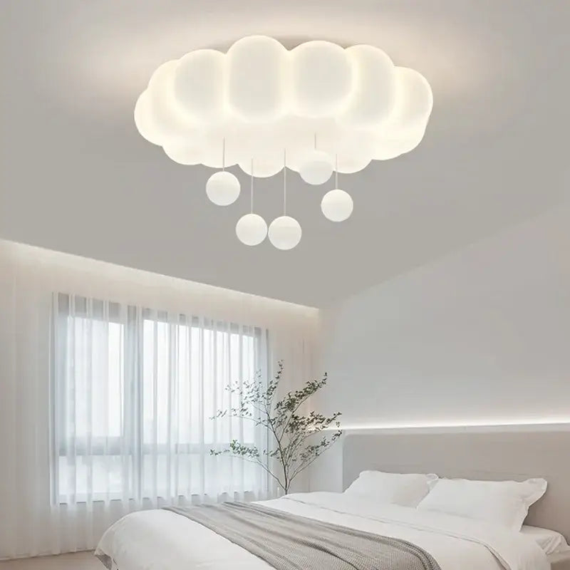 A soft off white cloud shaped pendant light with hanging spherical bulbs decorbites dimming pendant chandelier light