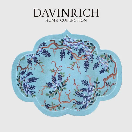 A light blue cloud shaped door mat featuring purple wisteria grape vine chinoiserie from davinrich home collection