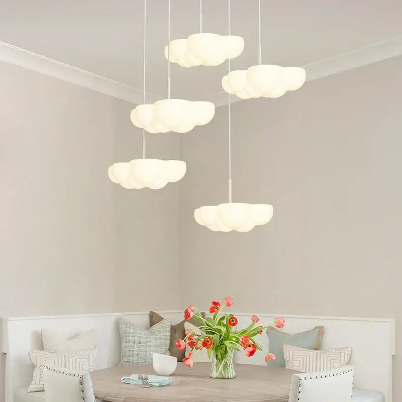 Cloud white modern white chandelier with cloud-shaped pendant lights hanging above floating kitchen island decorbites cloud white