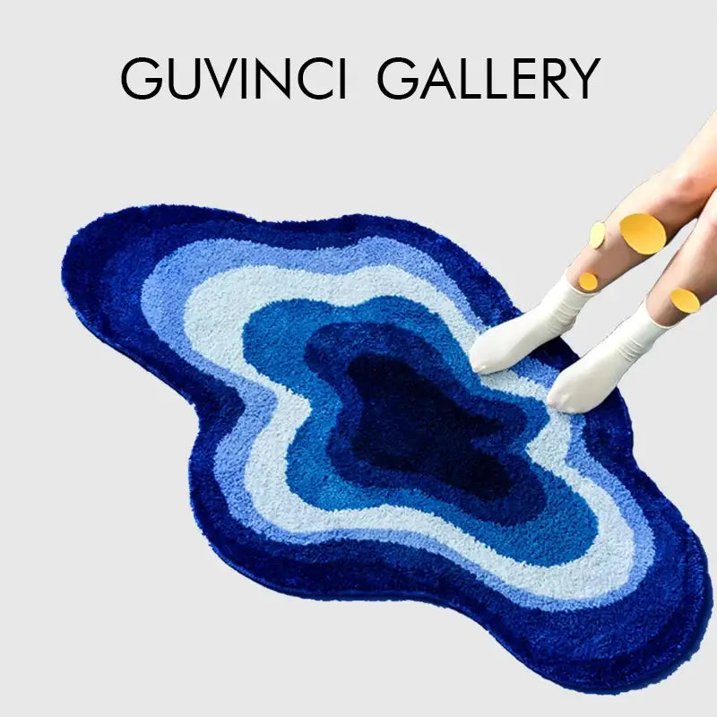 A plush layered blue geode bath mat with concentric rings from deep navy to sky blue for decorbites cloudy blues wavy retro bathroom decor