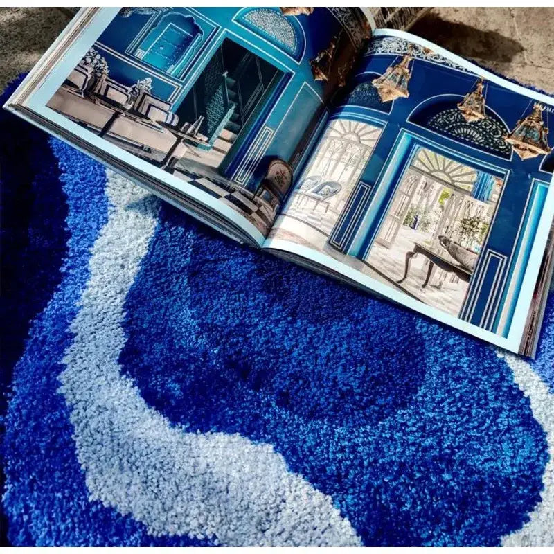 Open book on plush cloudy blues wavy retro bath mat with royal blue and light gray swirls decorbites cloudy blues