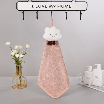 A soft pink plush hand towel with a fluffy white cloud handle and brown bow details from decorbites cloudy day set