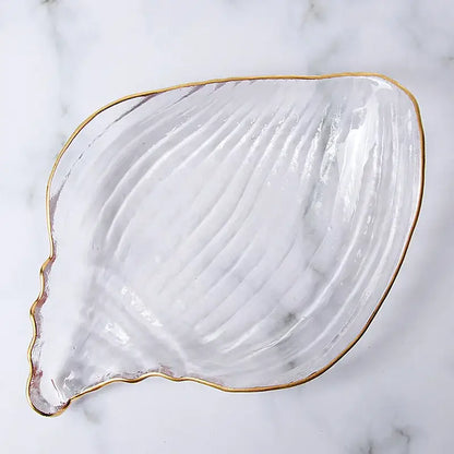 Clear glass seashell dish plate saucer with gold rim and ribbed texture for coastal blue dining room snack set