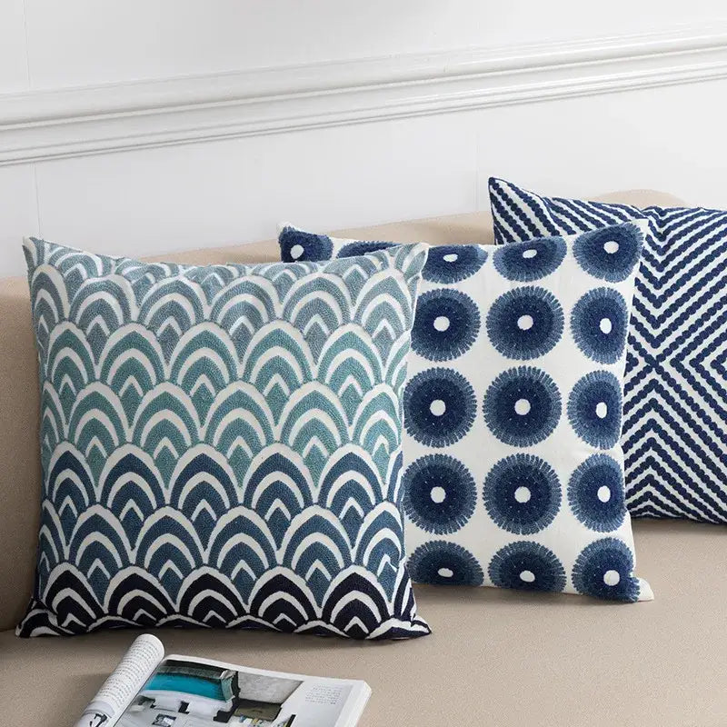 Three decorative coastal chic cushion covers in blue and white with embroidered geometric patterns for living room decorbites coastal chic