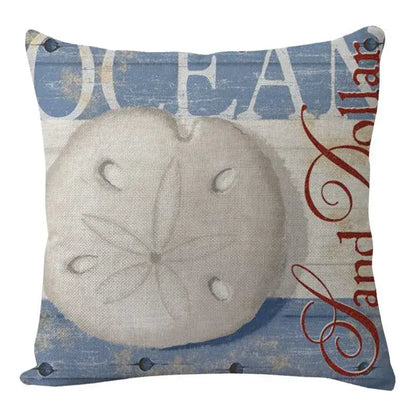Beige sand dollar on blue and beige distressed fabric coastal cushion cover from decorbites coastal cushion set