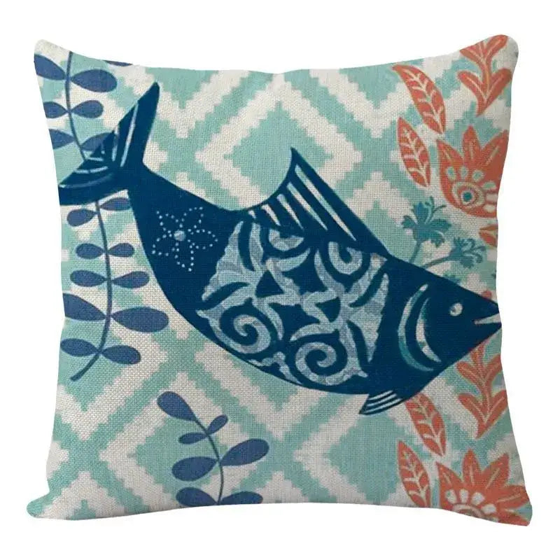 Decorbites coastal cushion cover featuring a navy blue fish with white patterns on teal and cream geometric background