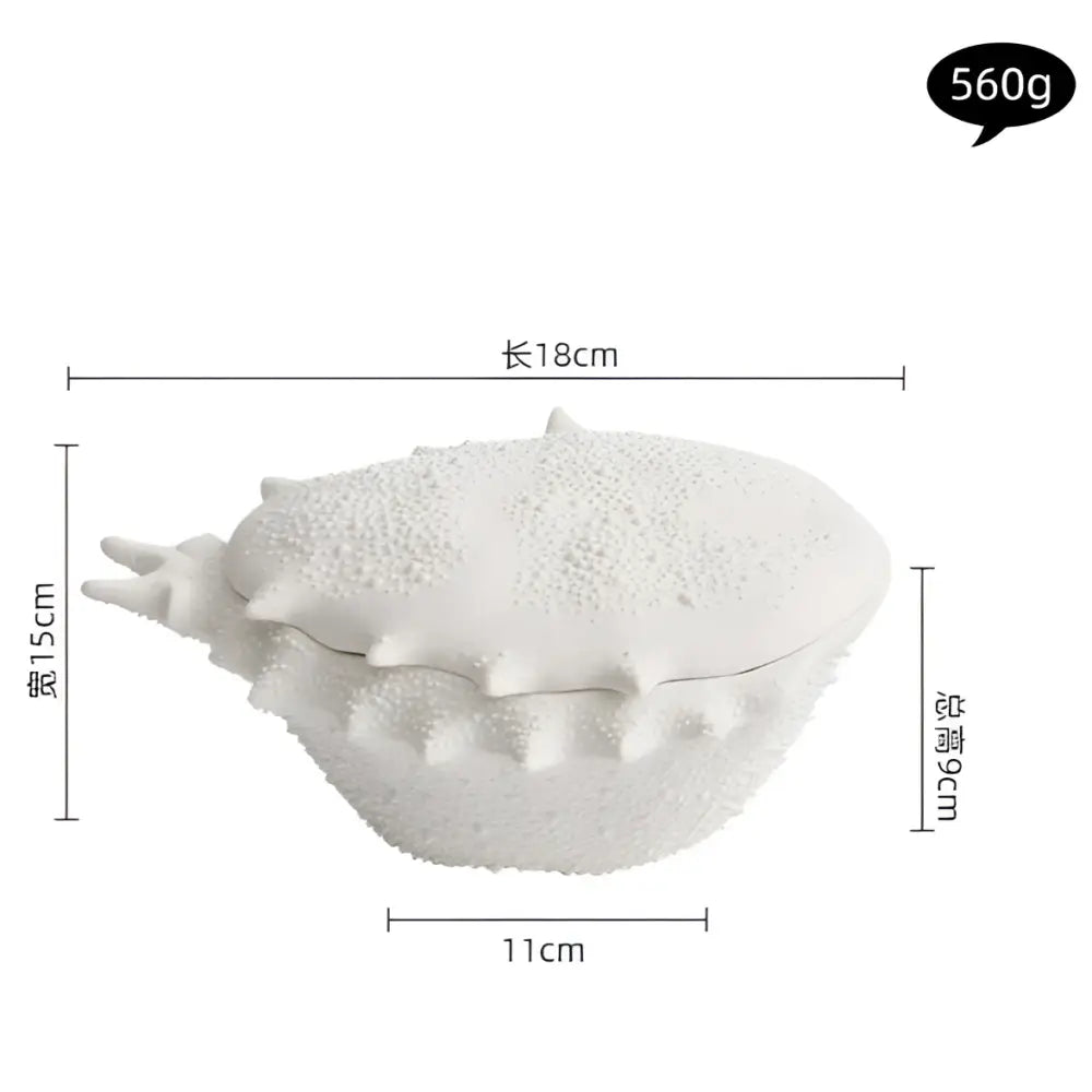 White ceramic seashell-shaped decorative ceramic soup bowl with textured surface and spiky ridges for dining room use
