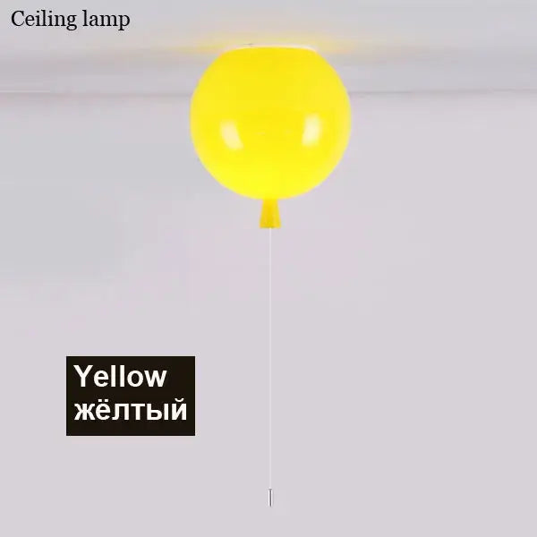 A bright yellow decorbites colorful balloon ceiling light with a glossy finish and thin white cord for bedroom and nursery decor